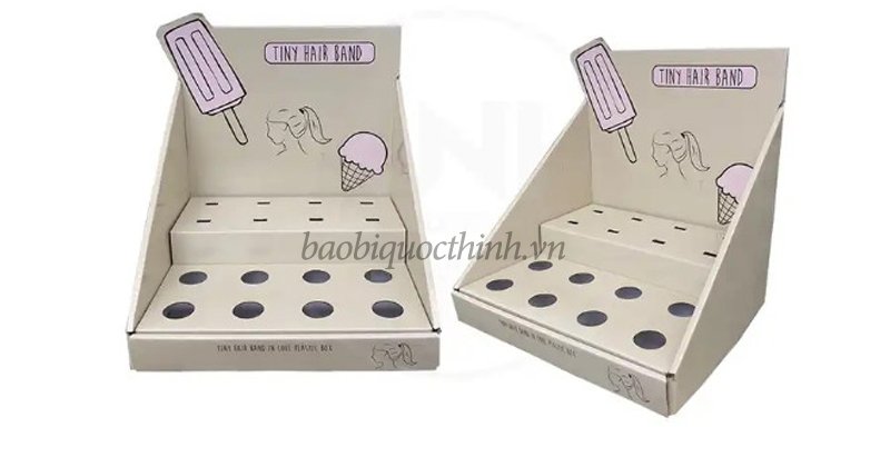 Bao bì Quốc Thịnh, đơn vị chuyên cung cấp, sản xuất và in kệ giấy carton 2 tầng trưng bày sản phẩm tại TP.HCM có uy tín